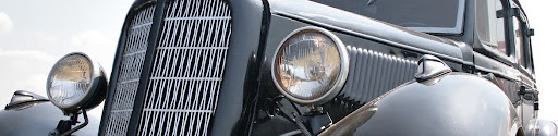 Front view of a 1940s classic vintage car showing period-correct exterior lighting, representing the turn signal and indicator light configurations used on historically accurate hot rod builds