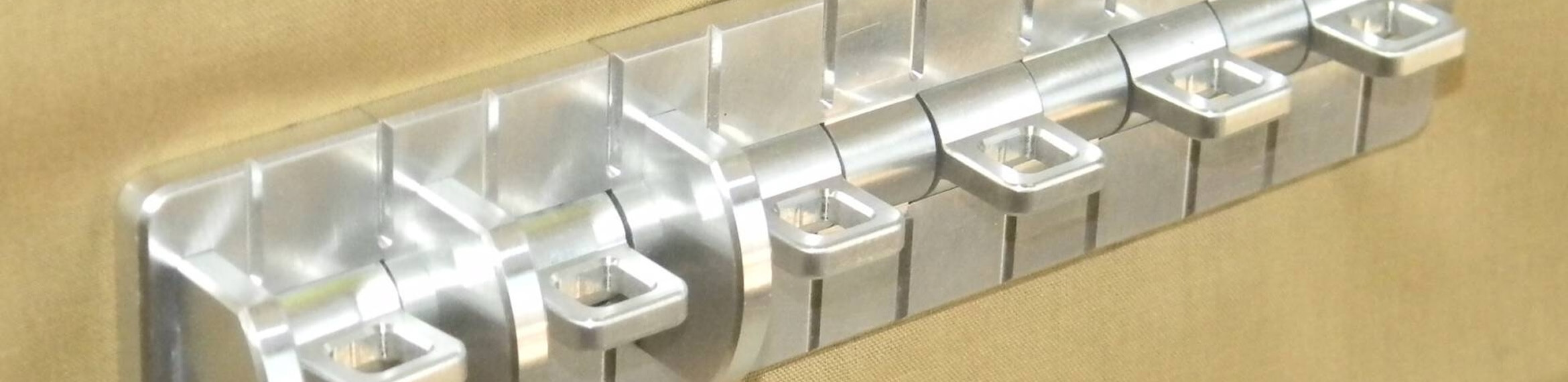 Close-up angled view of toggle switch mechanisms displaying internal construction with visible springs showing latching and momentary switch differences